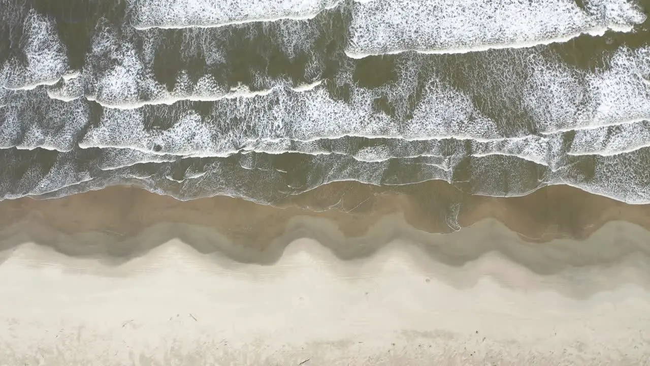 waves beach sand and water movement on a deserted beach