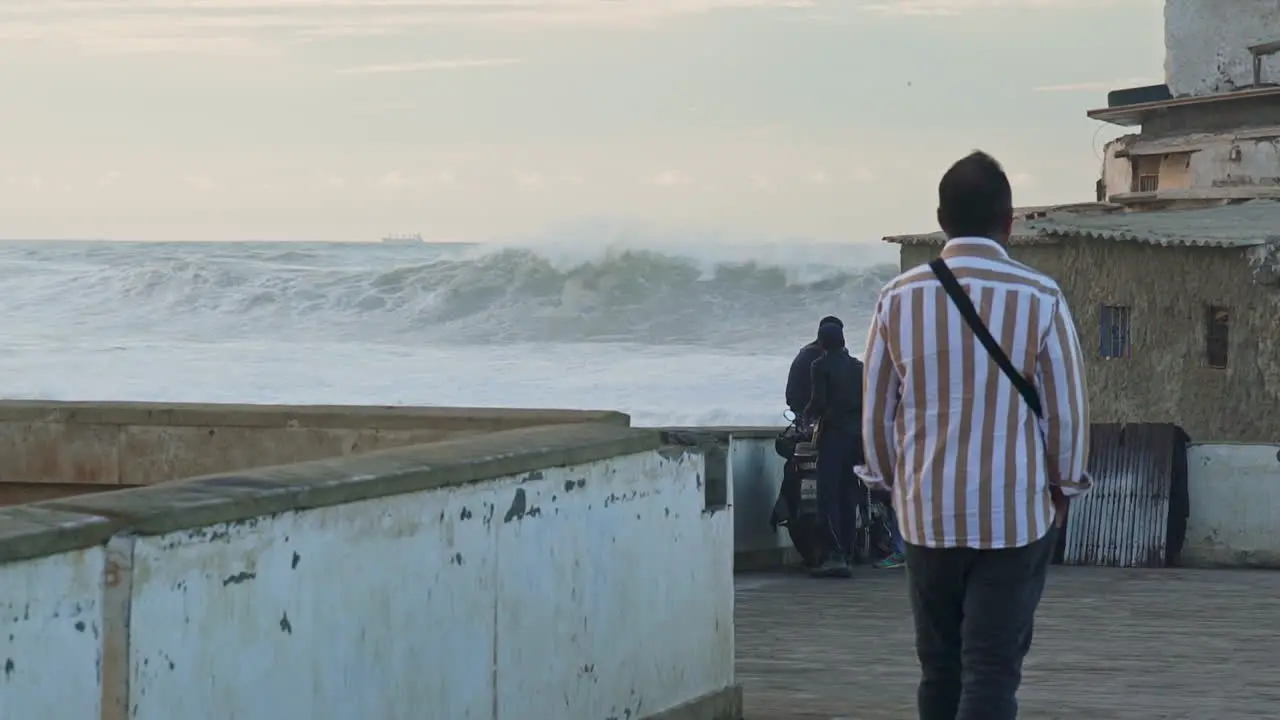 Moroccan men watching the ocean in Casablanca Morocco