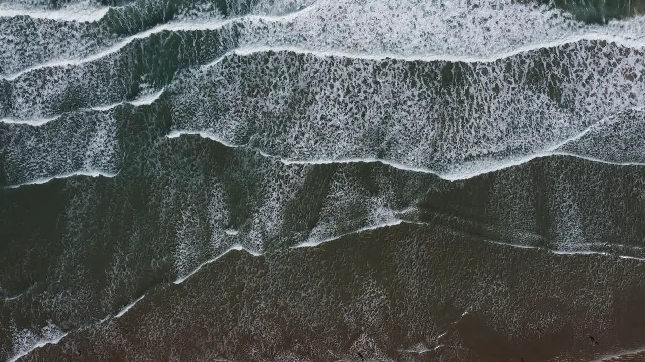 A view from above of the waves crushing on the sand in Tampico Mexico