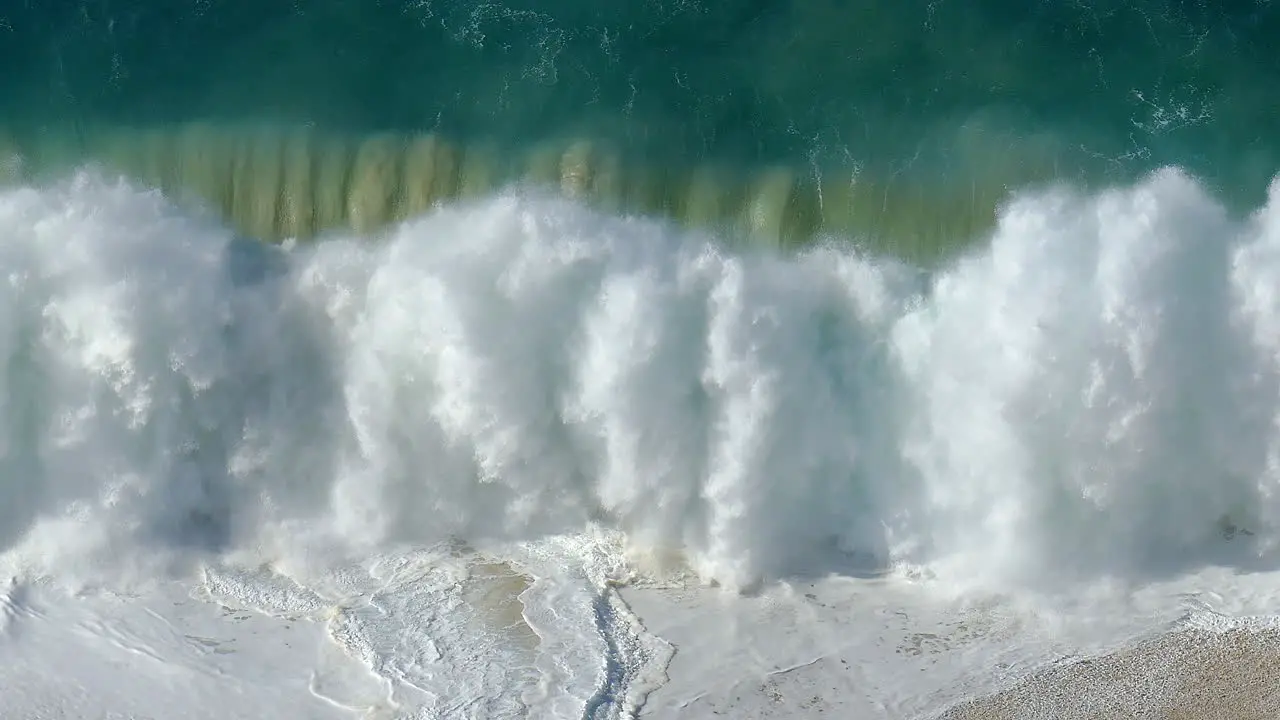 Footage of a large wave violently crashing on the shore in Cabo San Lucas Mexico