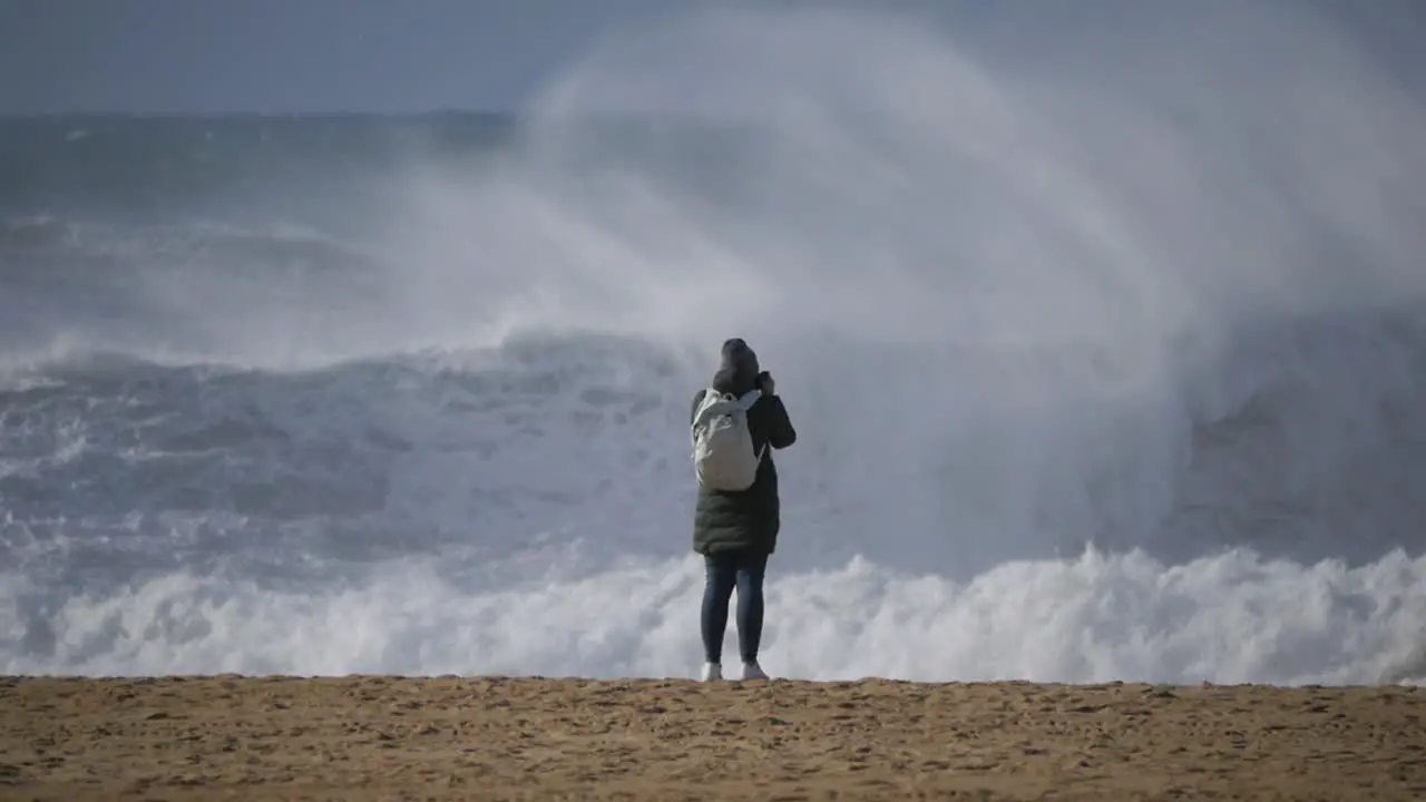 Slow motion of a wave break on the beach in Nazaré Portugal