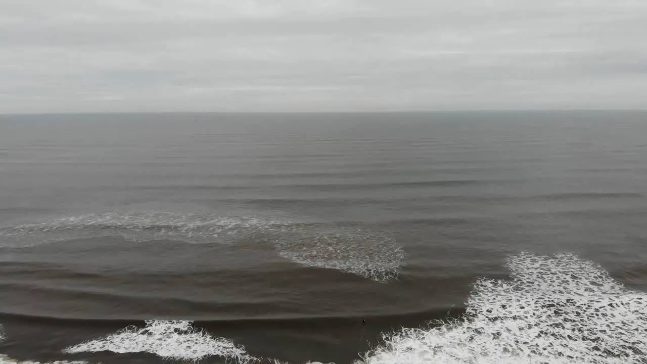 Drone flying over surfers in Scarborough Yorkshire UK