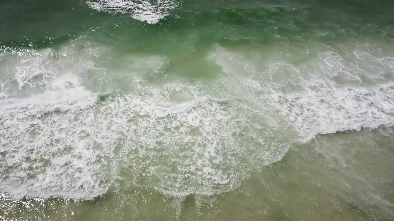 Splashing Foamy Waves Of The Sea In Summer aerial drone shot