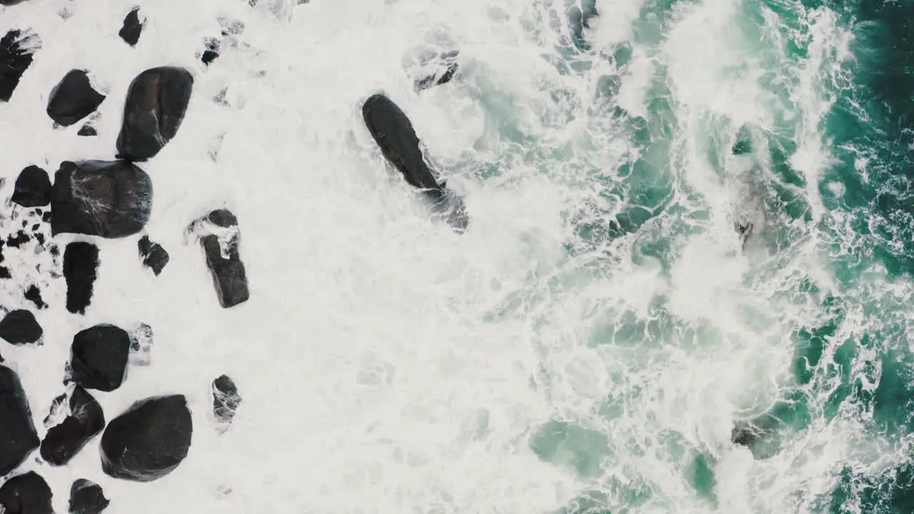 Flying Above Sea Waves Breaking on Rocky Coast