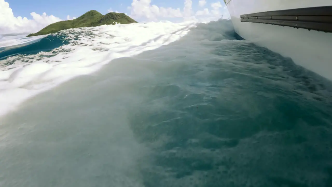 Seychelles St Anne marine park Boat breaking waves heading forward