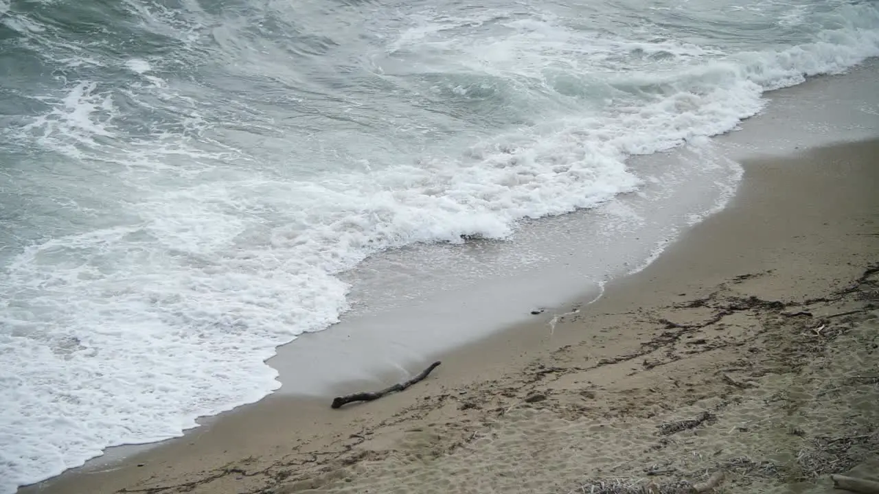 Wider shot of turbulent sea shot from higher level