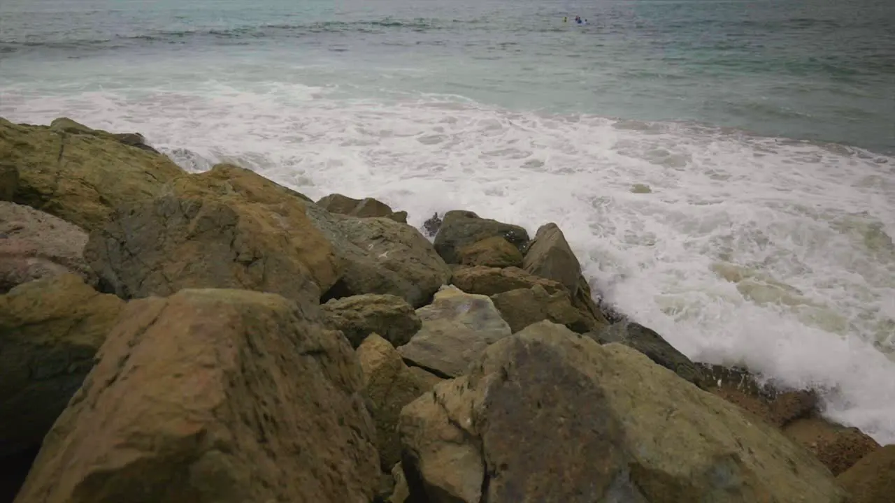 Waves crashing on rocks in slow motion