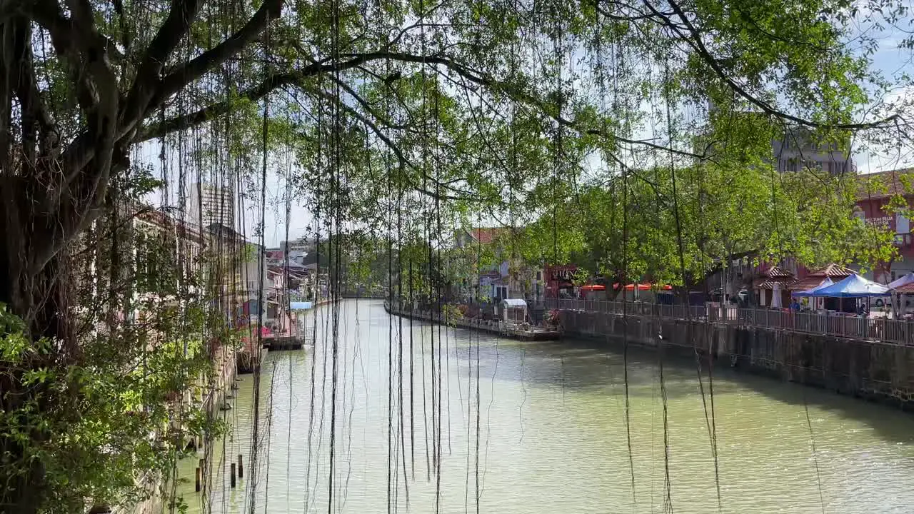 Slow motion scene of a bright sunny day river view of Malacca  Malaysia