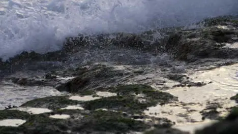 Long Shot of Waves Crashing On Rocks