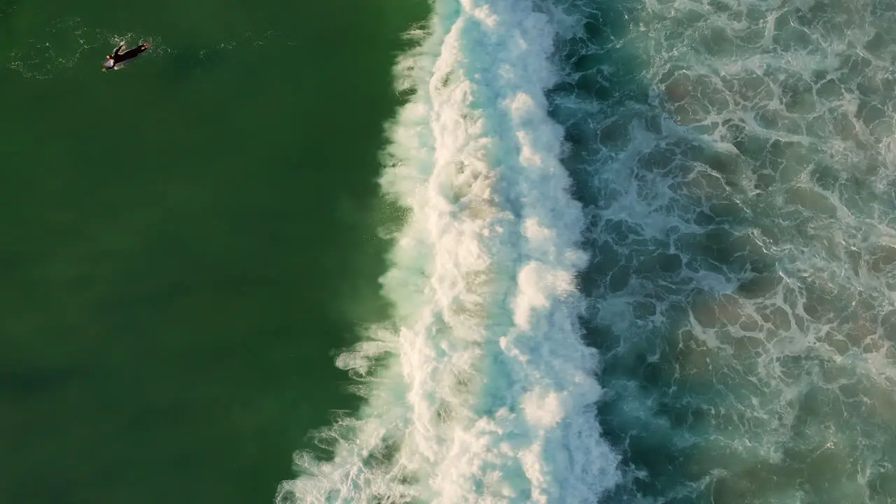 Top View Of Surfers On Splashing Foamy Waves At Llandudno Beach In Cape Town South Africa