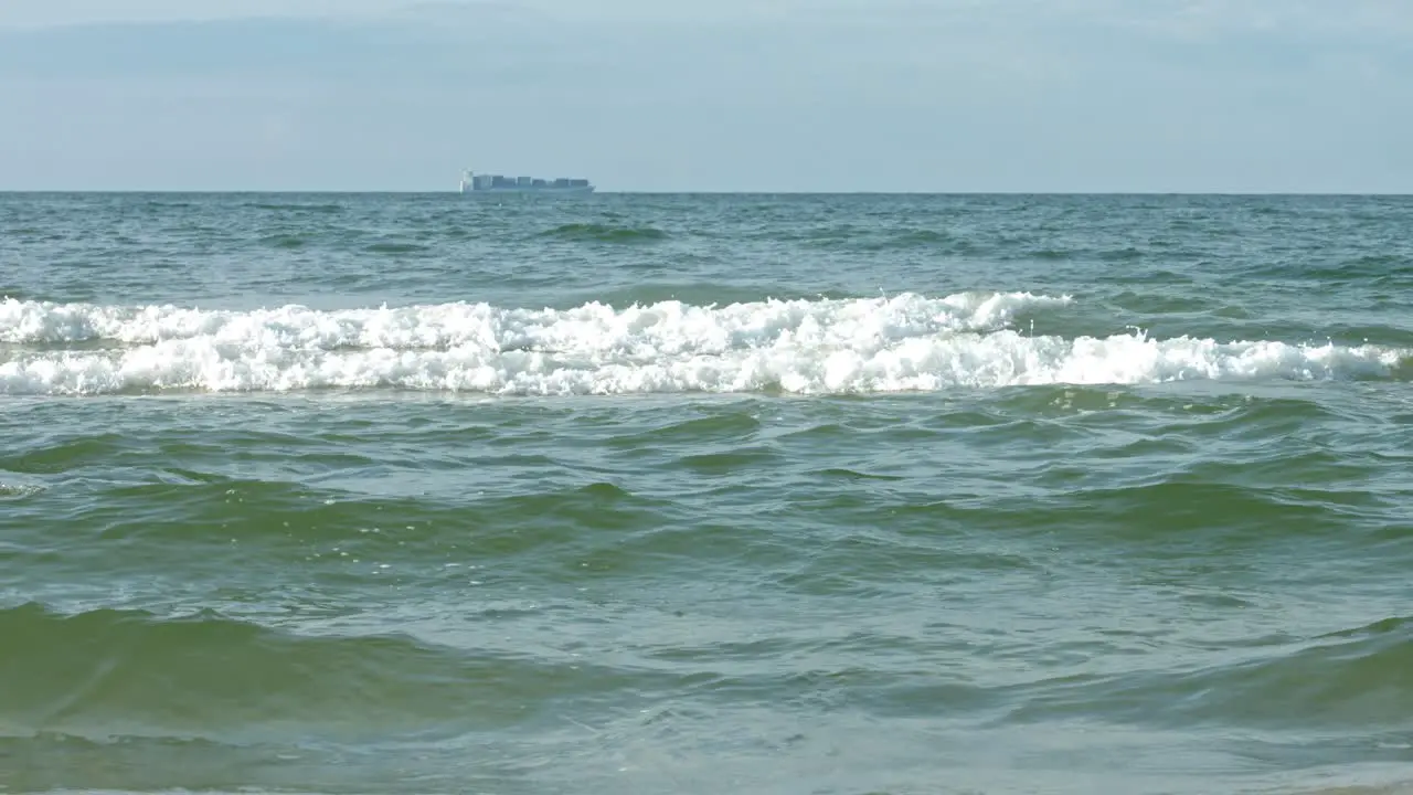 A woman having energy to run in the ocean waves as a relaxation