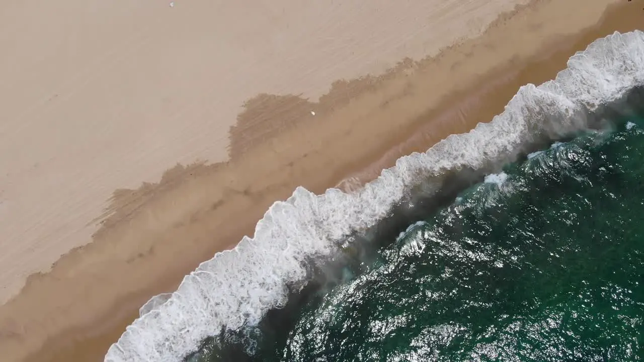 Waves crashing on beach near Todos Santos Mexico