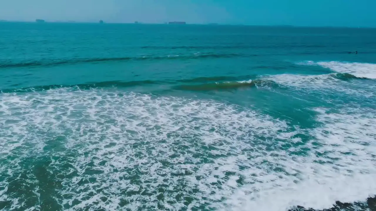 High angle shot of waves rolling into shore