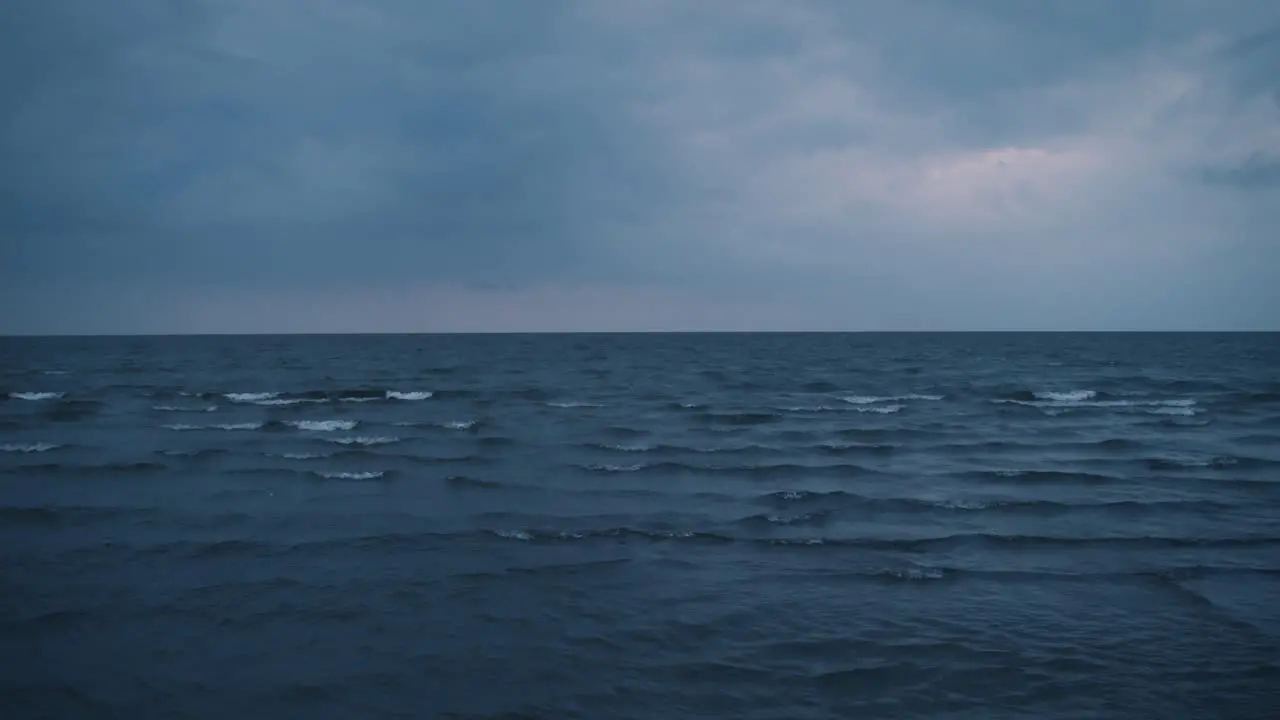 Overcast moody horizon seen from the shore of