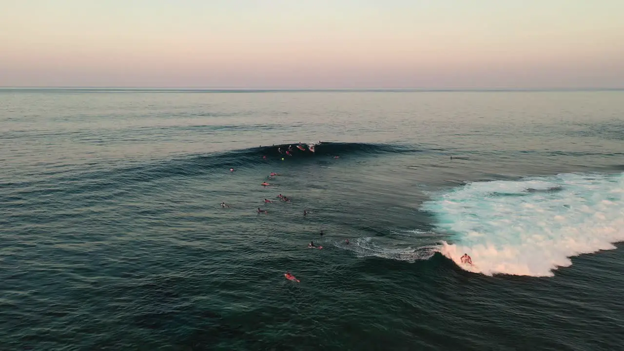 Aerial View of Surfers on Waves at Surfing Area on Evening Sun Siargao Island Cloud 9 Philippines