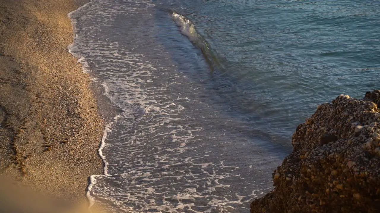 Stunning scenery at golden beach with slow motion breaking waves