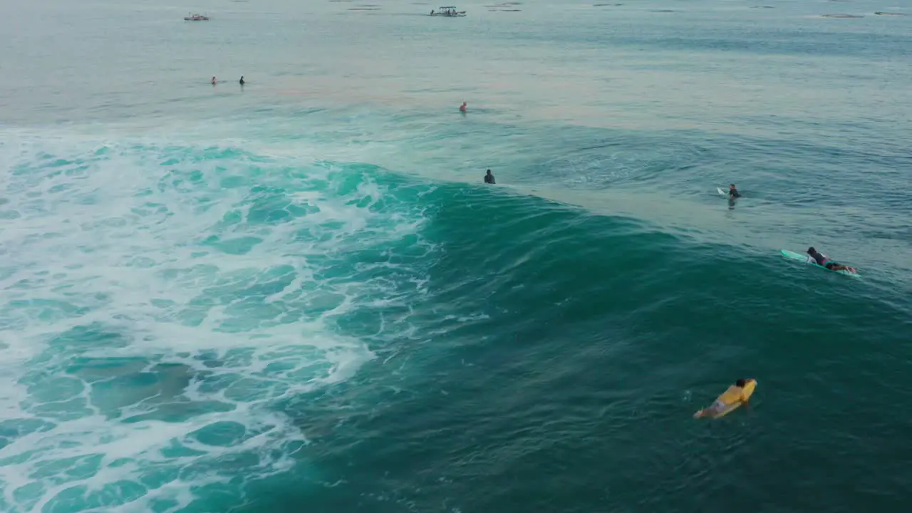 Surfing at sunset at the surf spot Don Don in Gerupuk Lombok