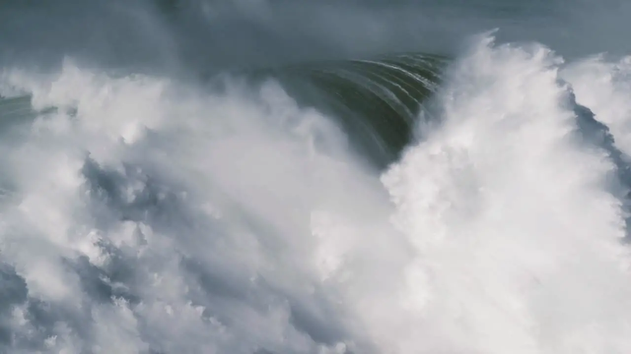 Slow motion of two big waves in Nazaré Portugal getting together