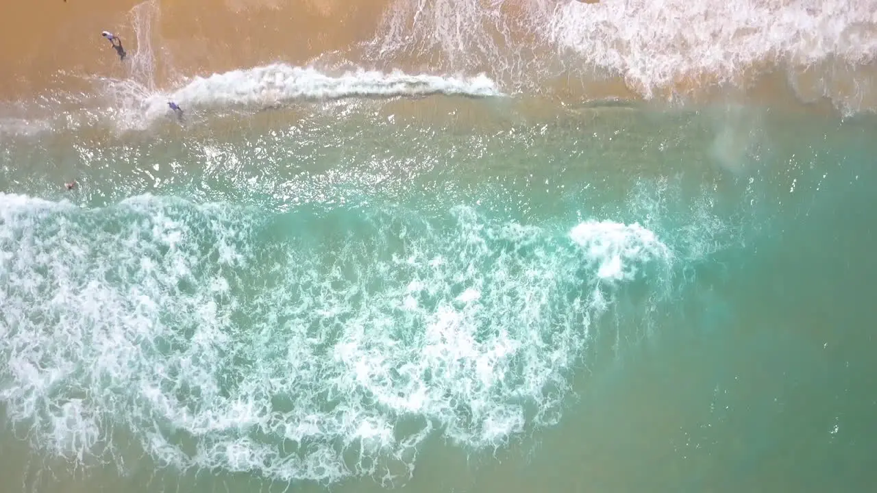 Sunny Summer Aerial in Israel Ashkelon Beach Top down drone shot and tilt up to the city