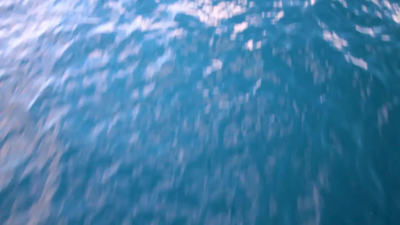 Waves crashing in front of the boat and pan into the horizon