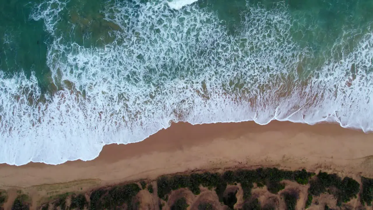 Vertical static drone footage of waves hitting the beach at Point Lonsdale Victoria Australia