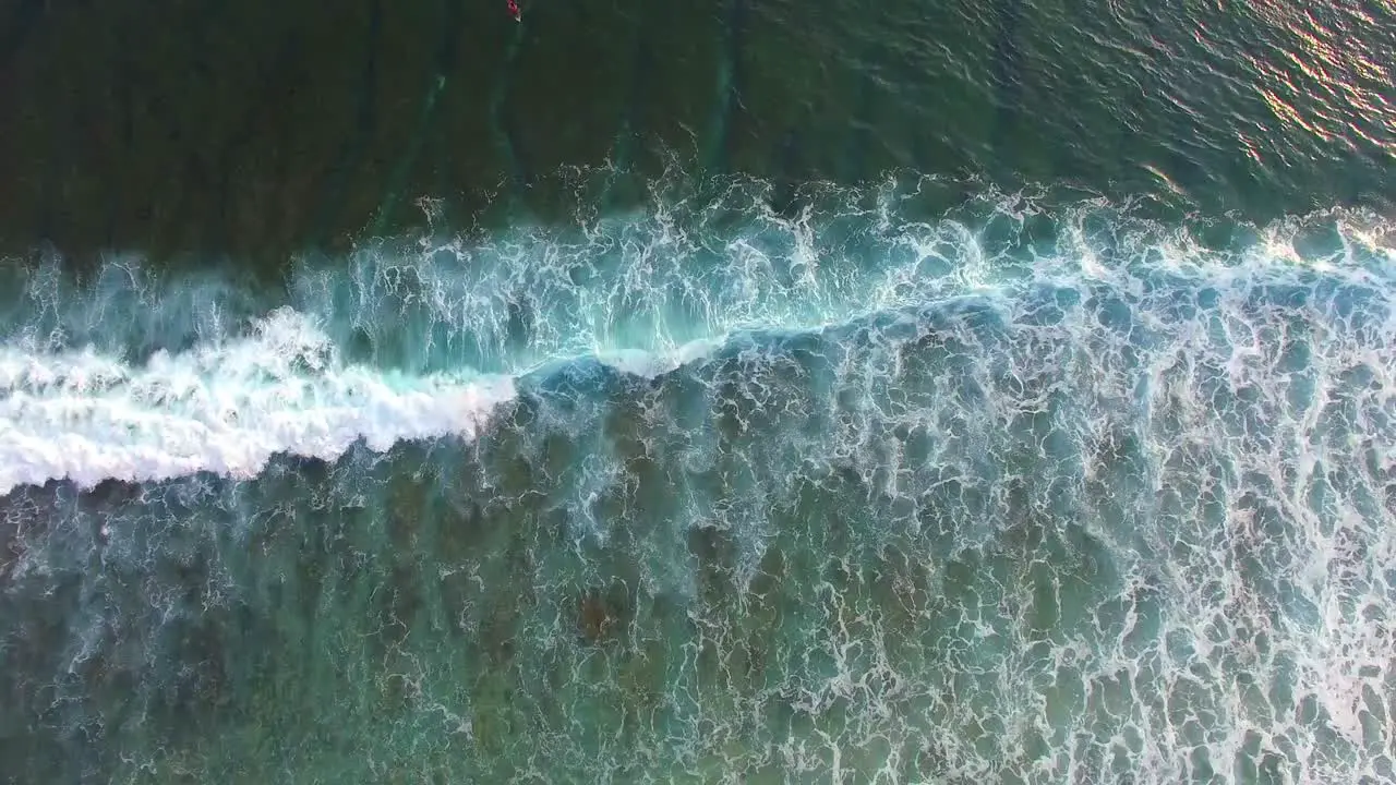 Flying Over Surfers in Picturesque Indonesian Bay