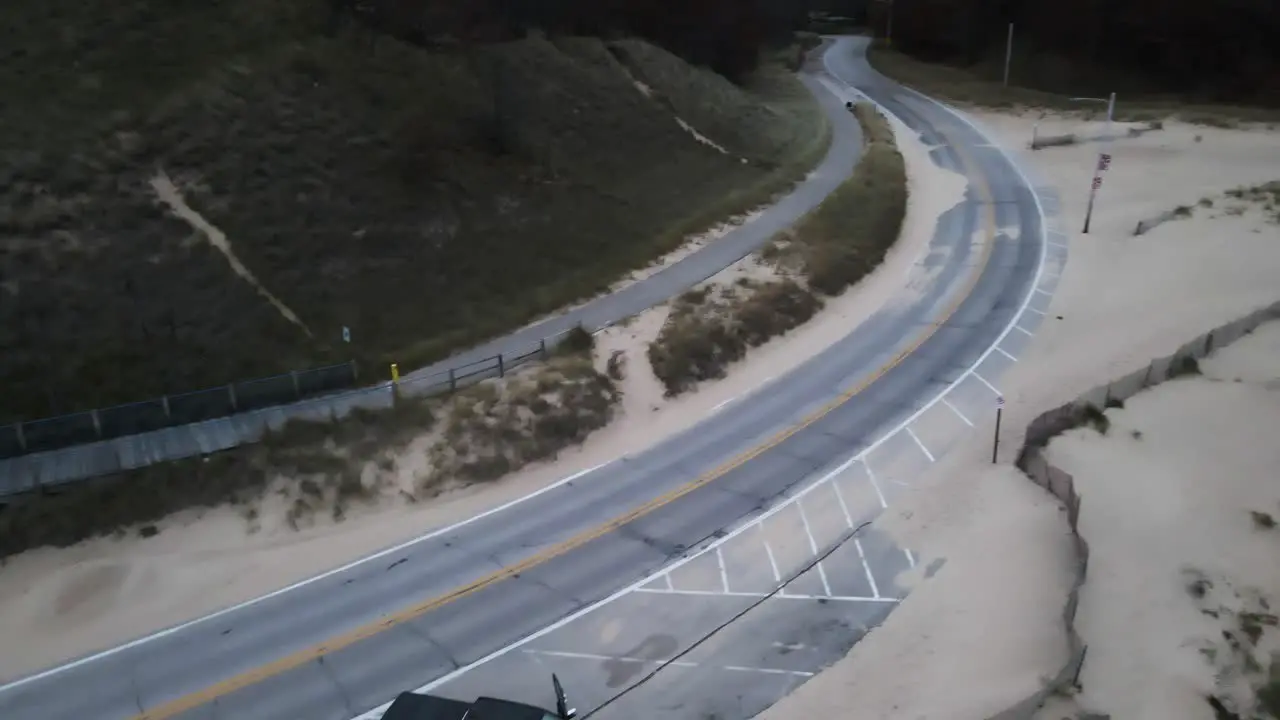 A truck parked along the coast during winter storm