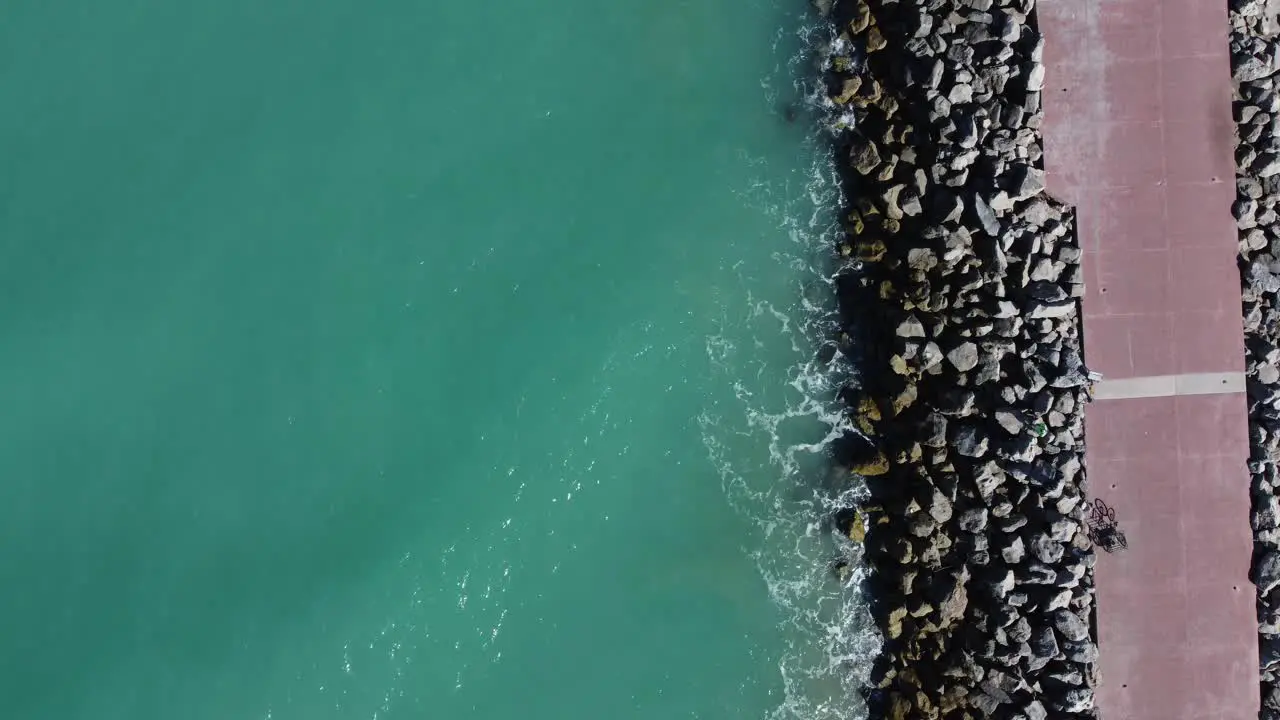 A view from above of the ocean waves crushing on the rocks in Tampico Veracruz Mexico