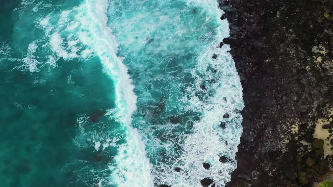 Aerial view of turquoise ocean waves crashing coastline of Nusa penida island one of the tourist attractions of Bali island Crystal beach kelingking beach angle billabong broken beach