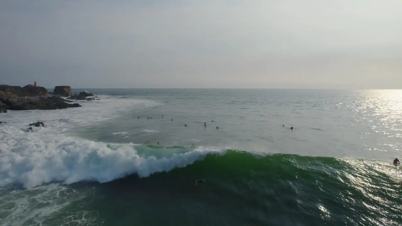 Aerial shot of a surfer catching a wave in Mexico