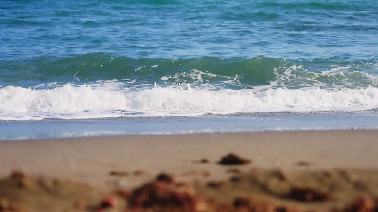 Soft ocean waves with blurred foreground