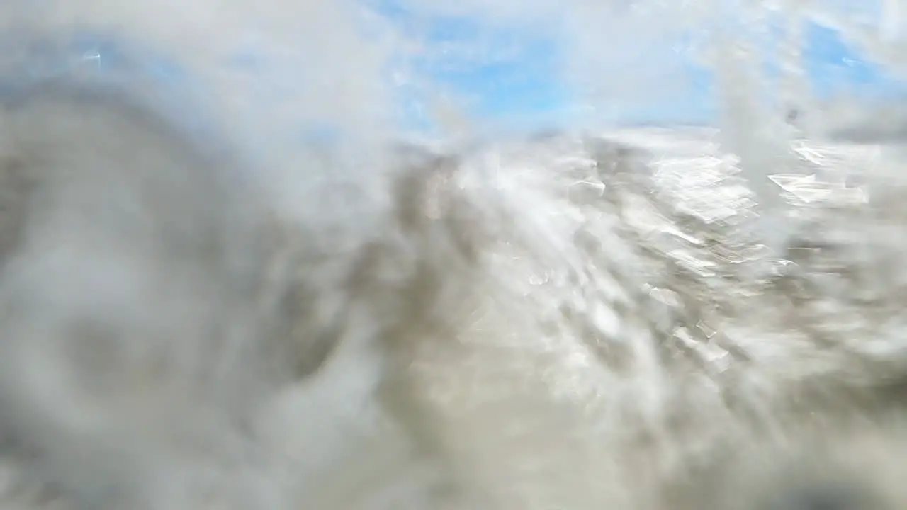 Large Wave Crashes on Coastline of Green Sand Beach on Camera