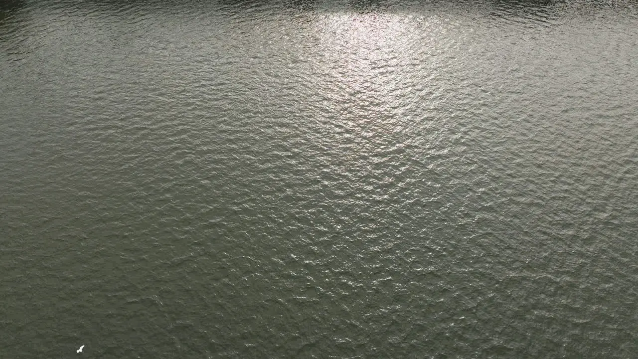 Aerial Drone shot of highway over a wide waterway bridge in Hong Kong