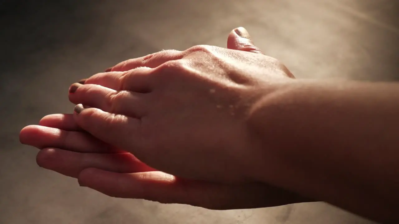 Hands rolling a chocolate truffle