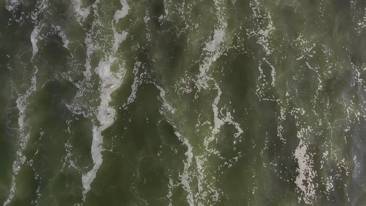 Beautiful straight down aerial over ocean waves