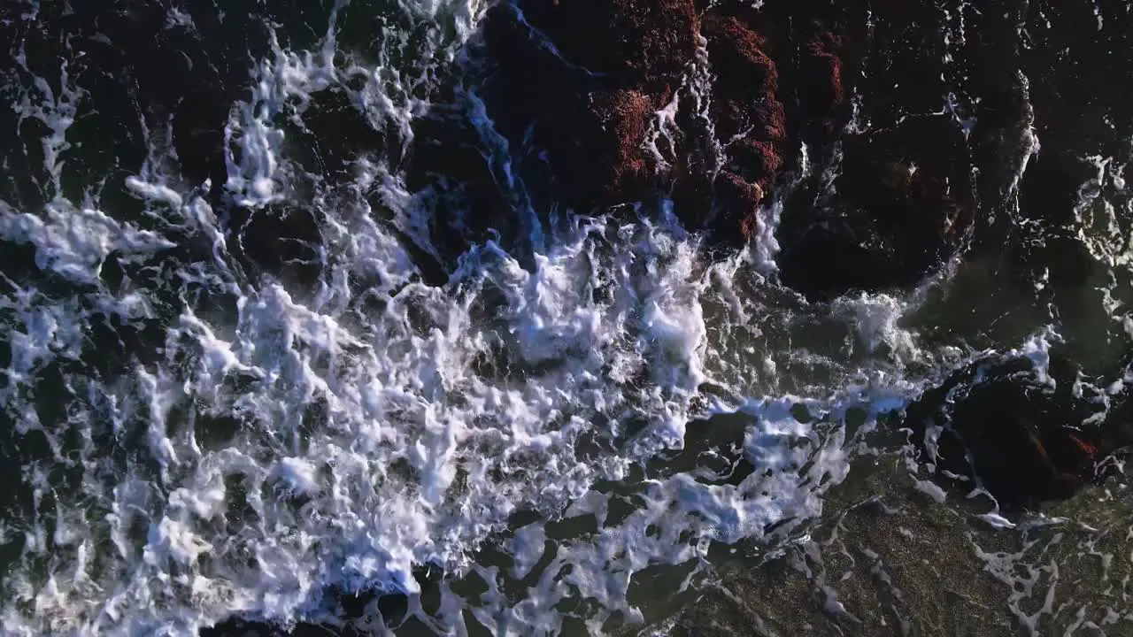 Aerial view of ocean waves moving up