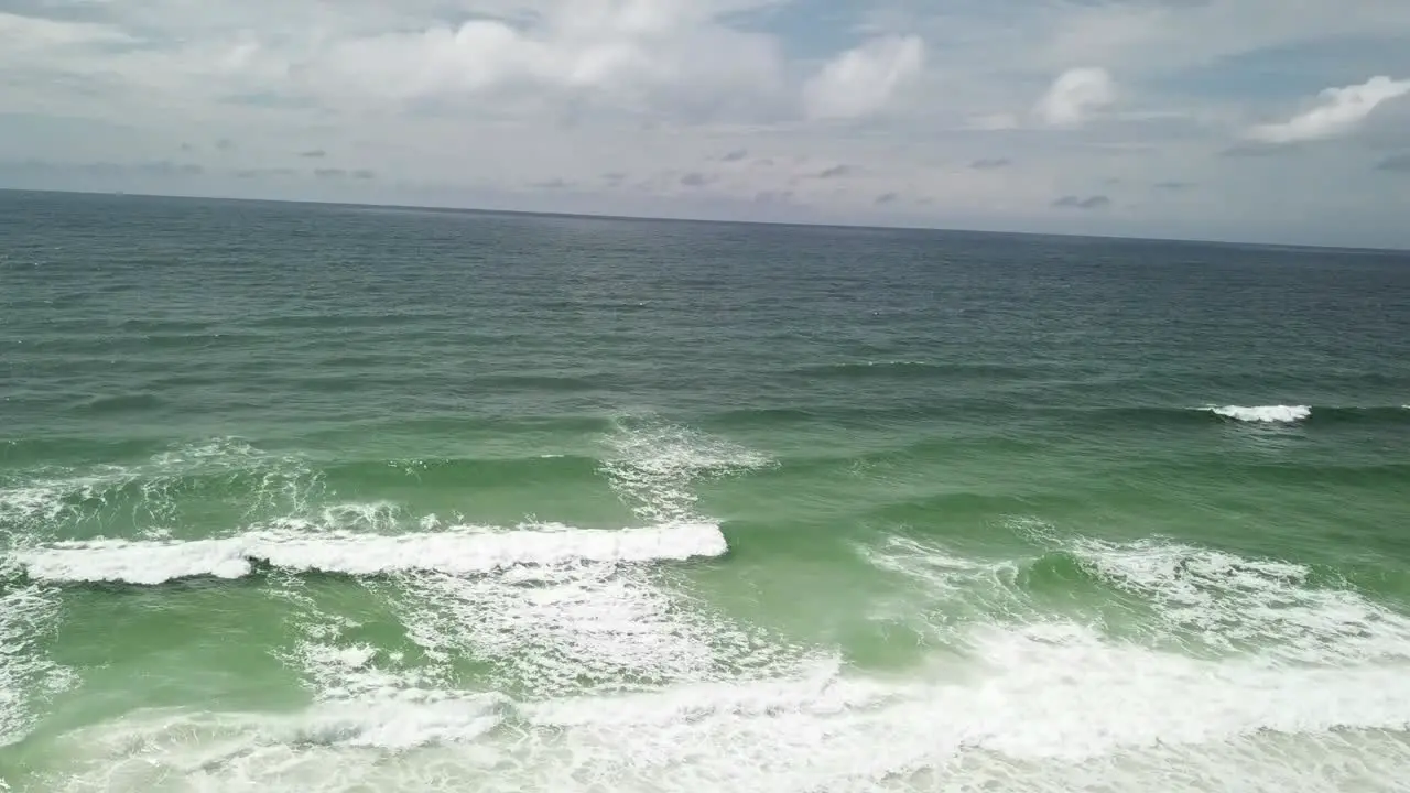 Deep Blue Sea Waters Splashing With Foamy Waves aerial drone shot