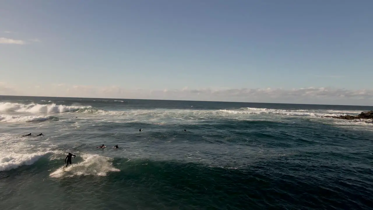 Surfer is surfing a wave in fuerteventura playa blanca spain