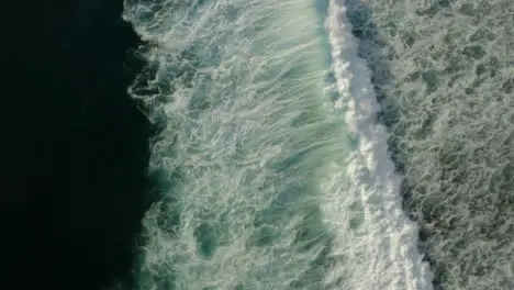 Drone Shot Rotating Above Waves Off Coast of Uluwatu 