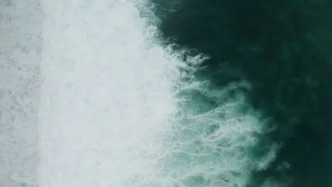 Drone Shot Looking Down at Uluwatu Coast Waves