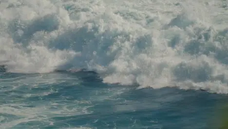 High Angle Shot of the Waves Crashing Off the Coast in Bali