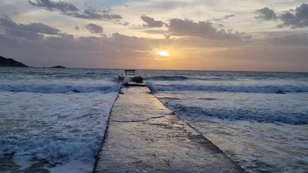 watching the stormy sea and the beautiful colors of the sky when the sun fall down