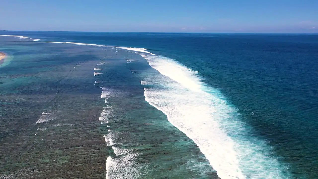 Aerial view over coral reefs and big waves in the coast of Reunion Island