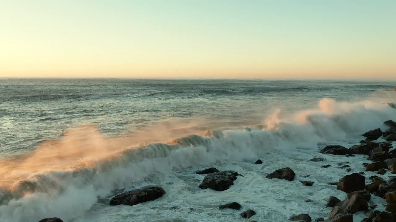 Huge Waves Hits The Rocky Shoreline During Sunset At Tidal Beach In Cape Town South Africa