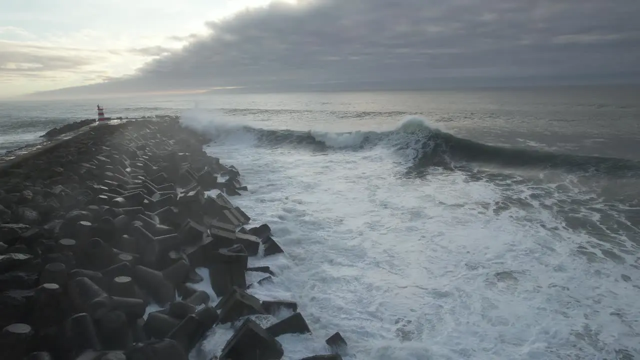 Stormy dangerous waves crashing on the rocks