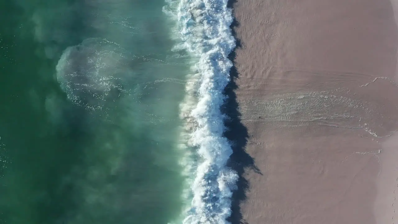 Vertical Shot Of Blouberg Sea With Foamy Waves Splashing On The Coastline At Cape Town In South Africa