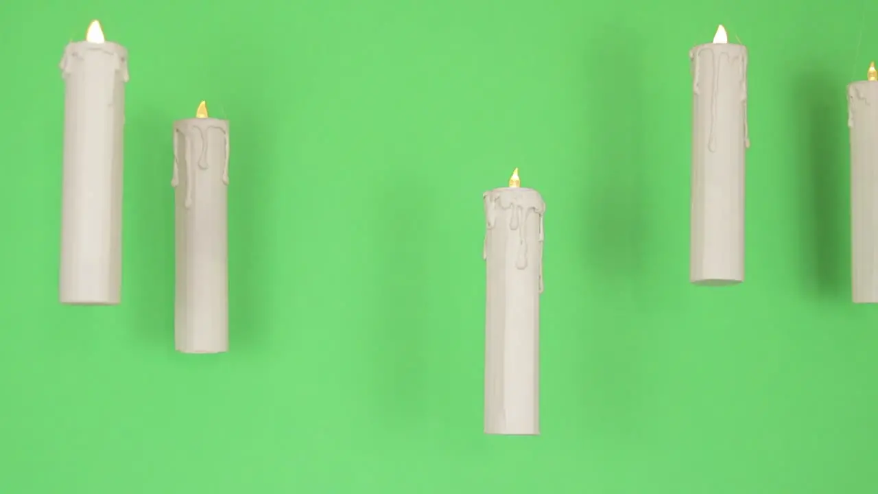 Floating candles with green backdrop  Green screen