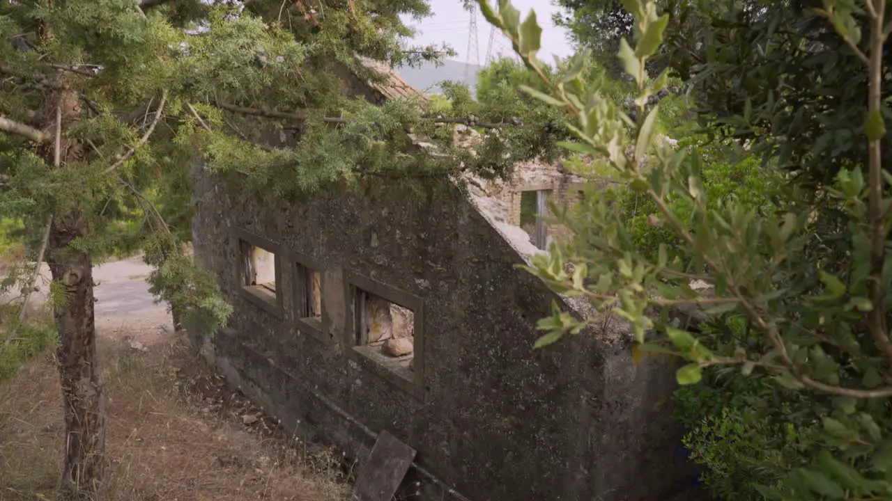 Pedestal down shot of old abandoned house in the woods located at Parnitha mountain Athens Greece 4K