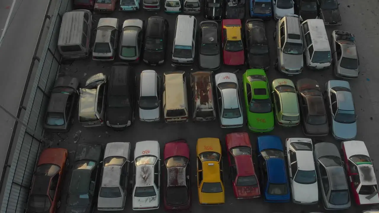 Car dump with hundreds of cars stacked waiting to be recycled at Kuala lumpur aerial