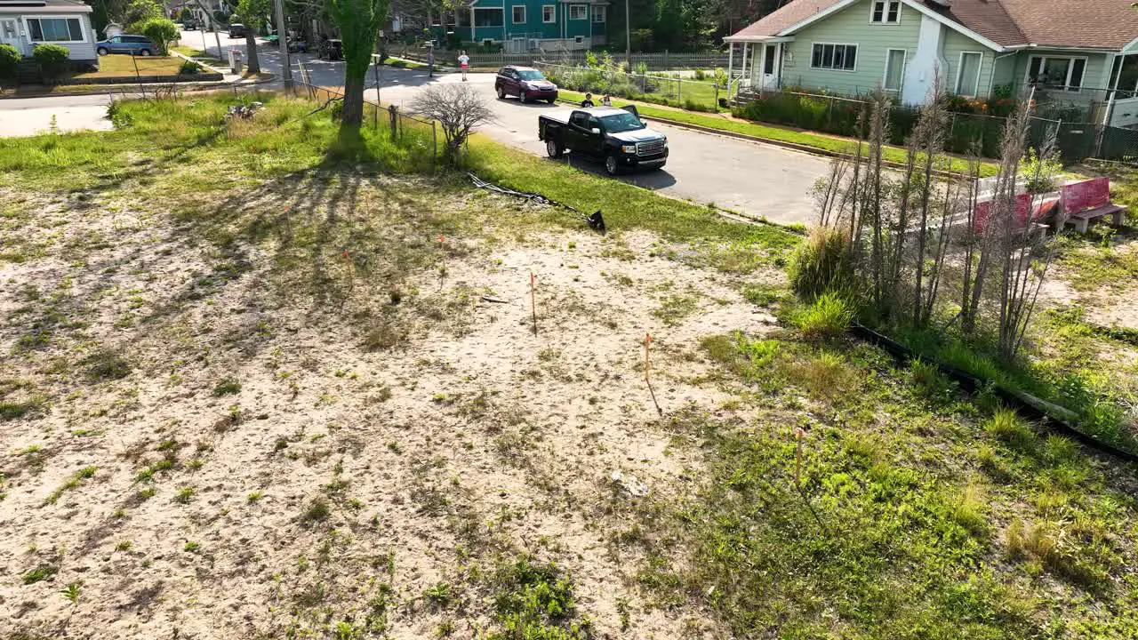 People near by watching a drone in the air